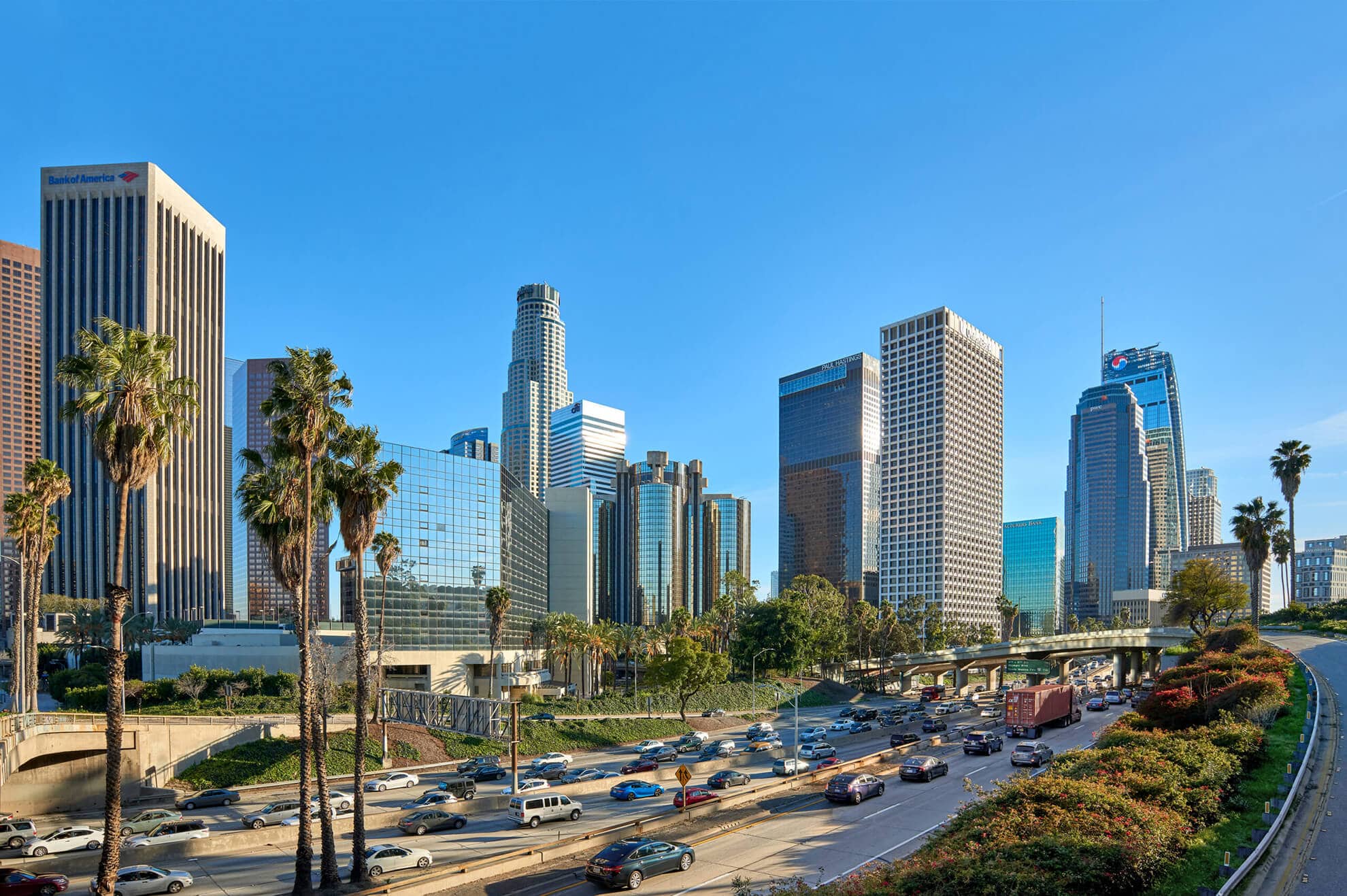 The skyline of Los Angeles with palm trees in the background is a breathtaking sight.