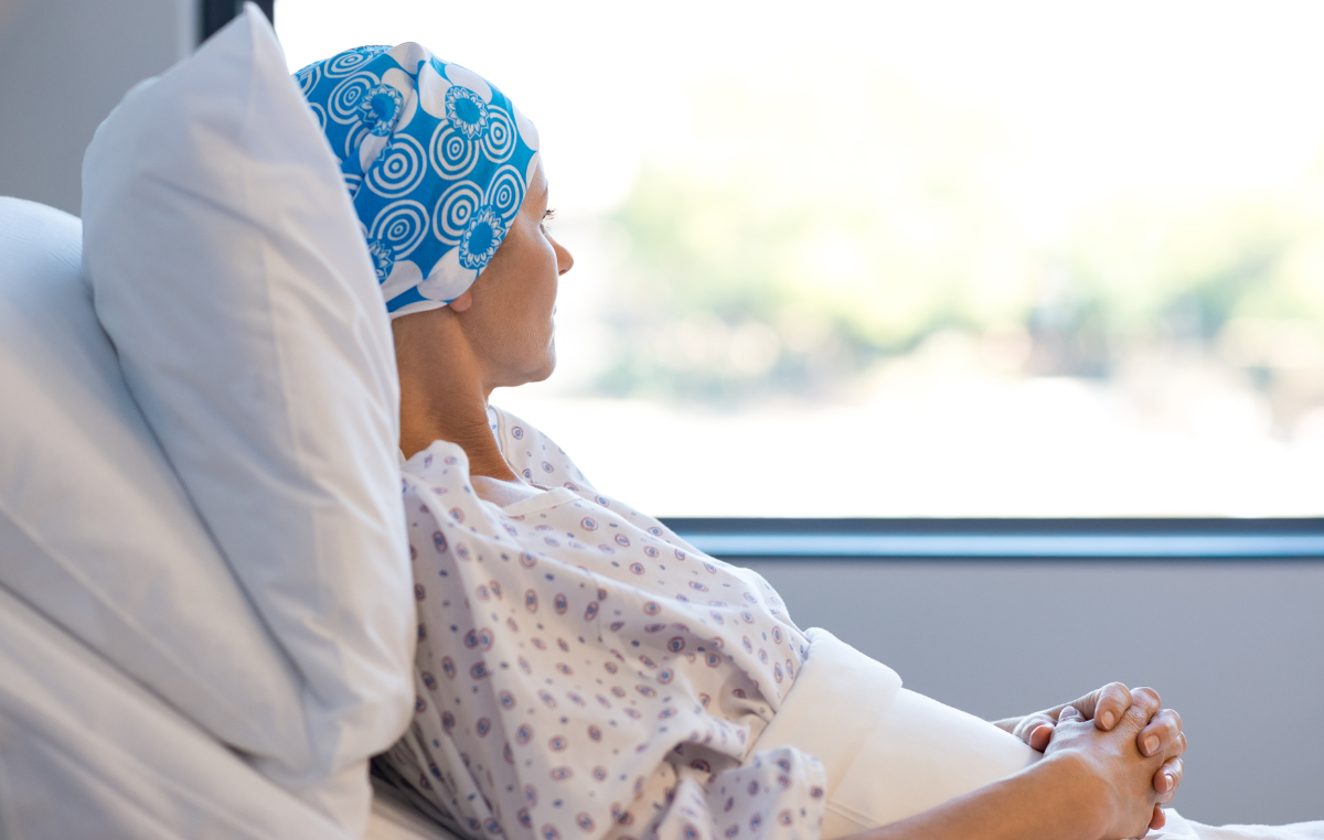 A woman in a hospital bed participating in an adrenal gland tumor trial.