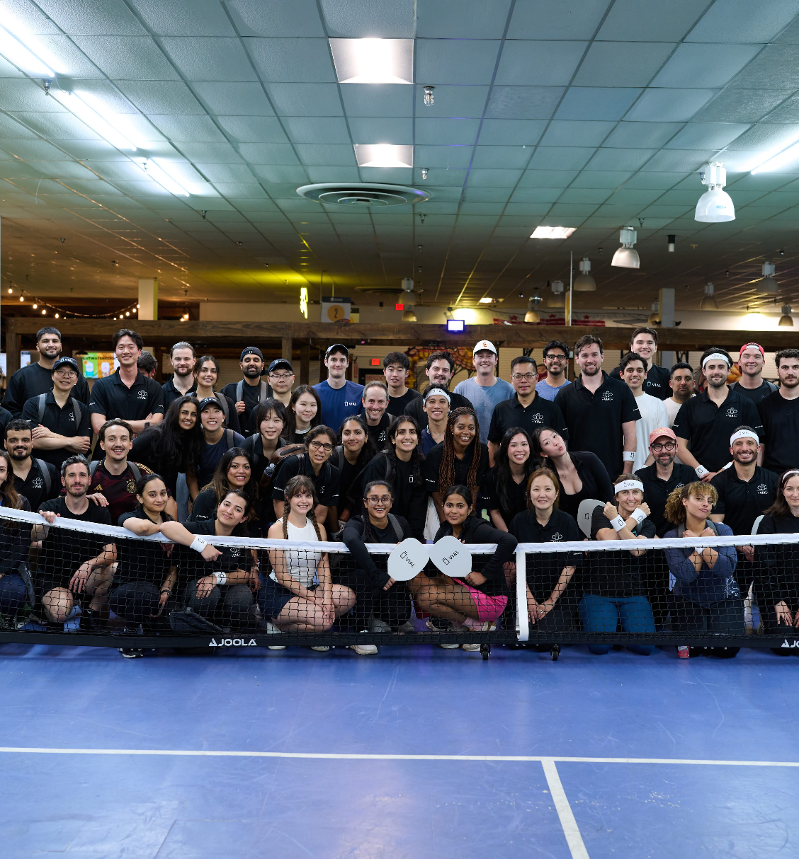http://People%20posing%20for%20group%20picture%20after%20playing%20pickleball.